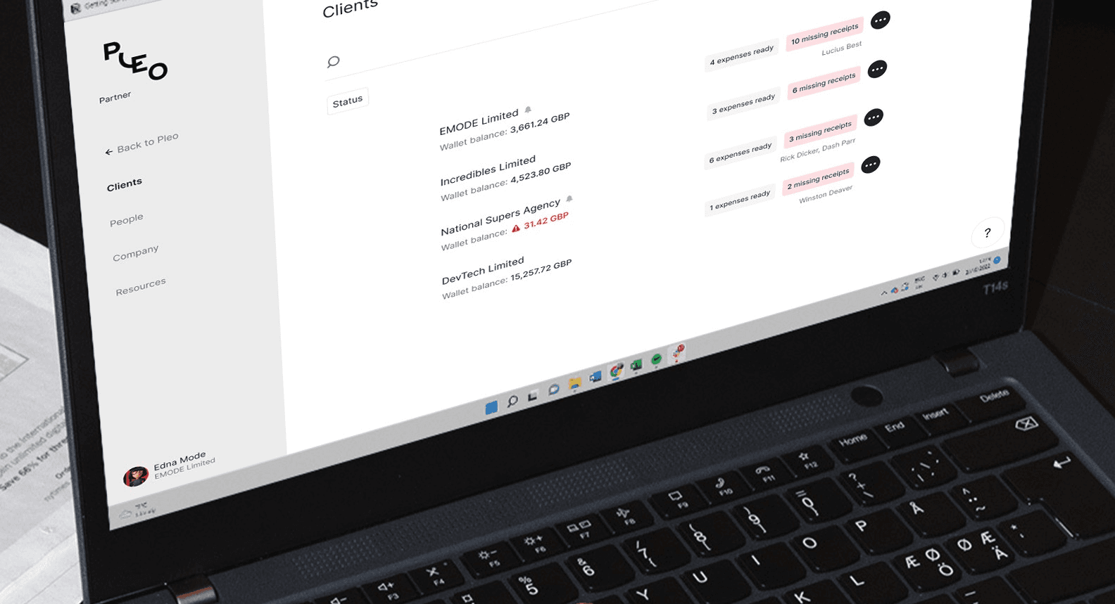 File Photo of a bookkeeper handling paper receipts in Pleo portal